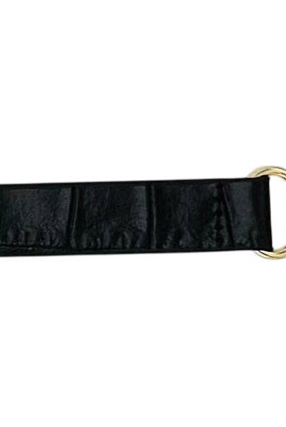 Black leather skinny belt from Garland Bags, featuring a sleek design and adjustable buckle for accessories and fashion style.