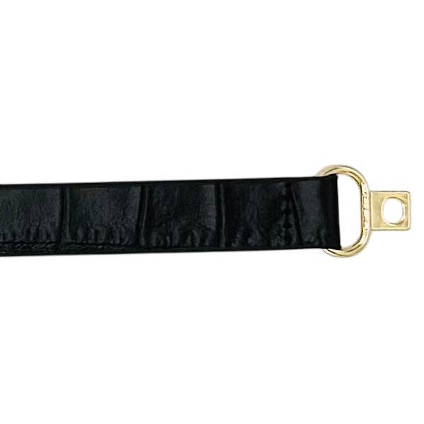 Black leather skinny belt from Garland Bags, featuring a sleek design and adjustable buckle for accessories and fashion style.