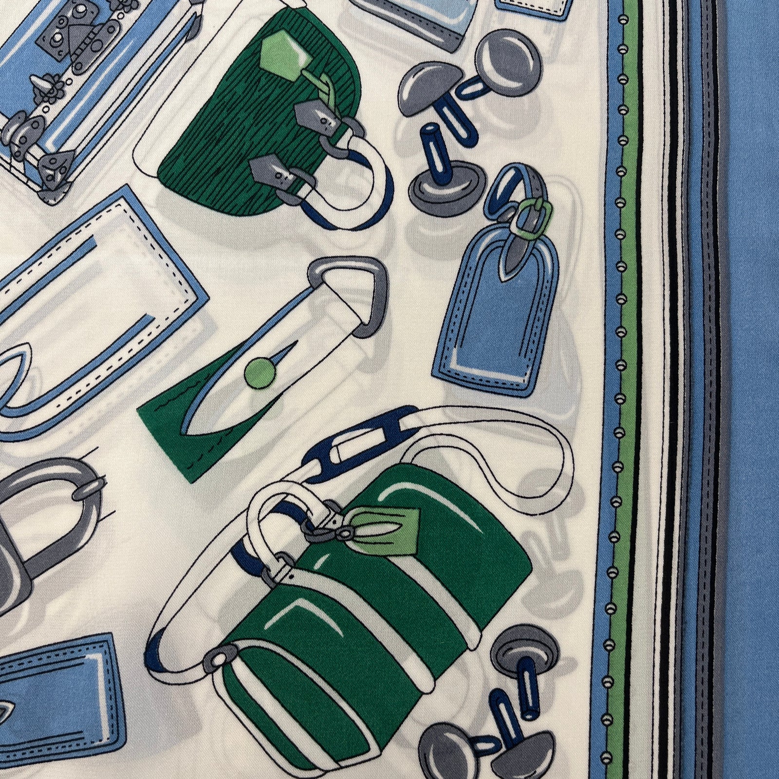 German Fuentes handbag scarf accessory featuring a stylish, colorful design draped over a handbag for a chic look.