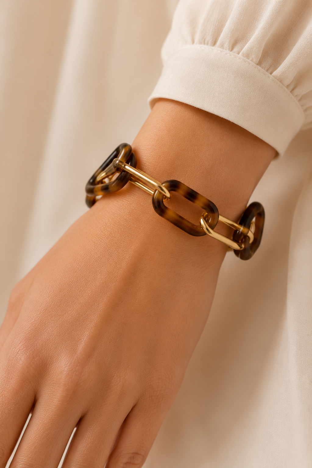 Tortoise Double Link Bracelet by Ali Bird worn on wrist, alternating tortoise resin and gold chain links