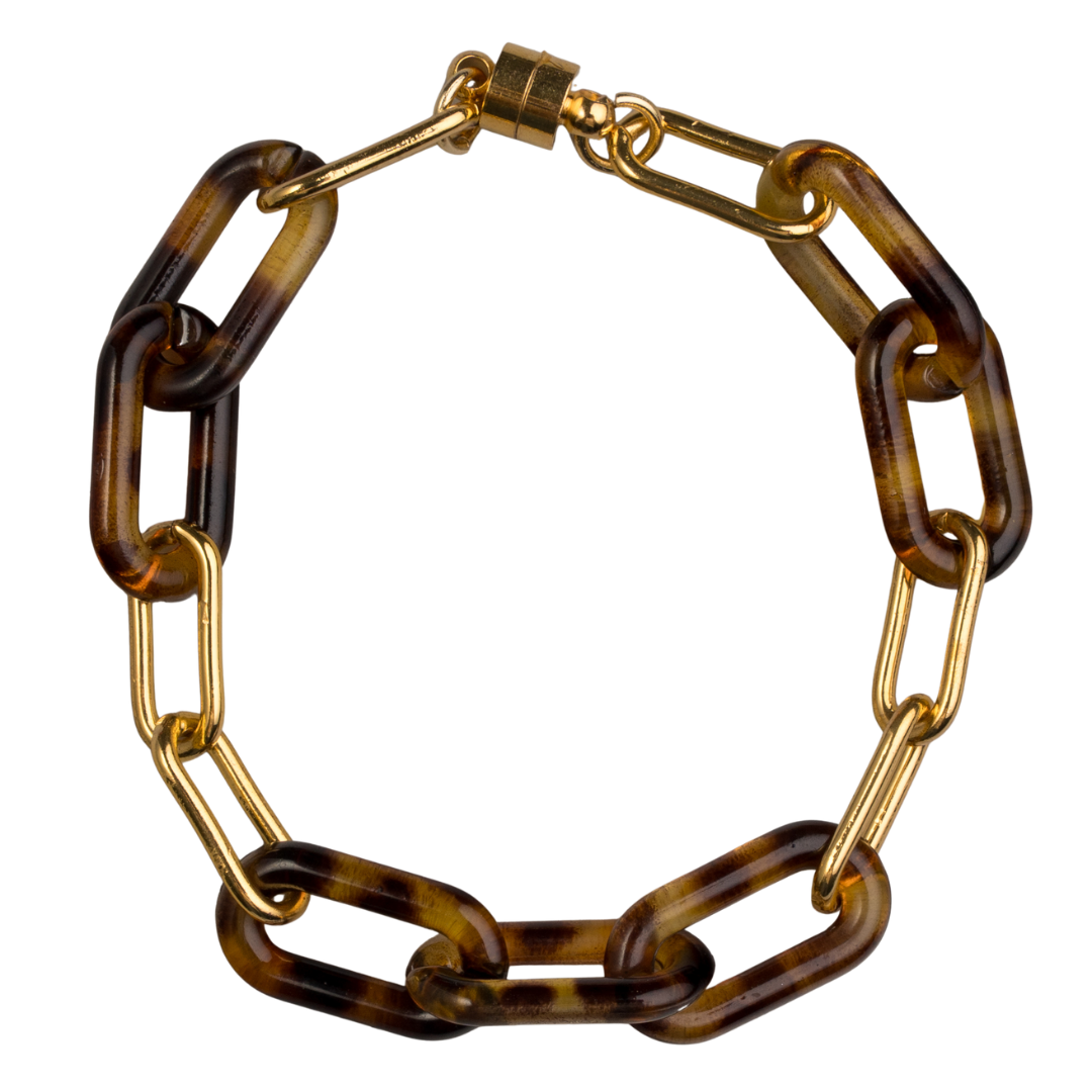 Tortoise Double Link Bracelet by Ali Bird, flat lay, alternating tortoise resin and gold oval links with gold barrel clasp