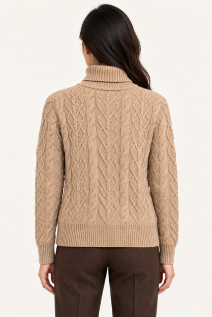 Kamaya Sweater by Another Love in Toasted Almond, back view showing allover cable knit, long sleeves, and ribbed hem