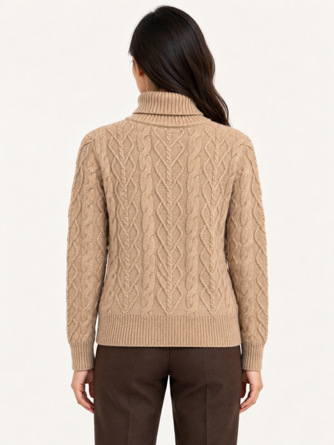 Kamaya Sweater by Another Love in Toasted Almond, back view showing allover cable knit, long sleeves, and ribbed hem