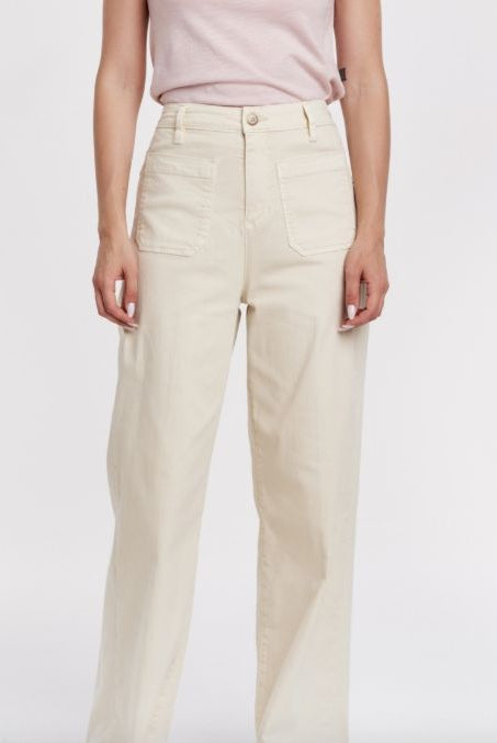 Light-colored high-rise Bristol Pants by Another Love featuring patch pockets and a relaxed fit, styled for casual wear.