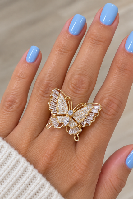 Butterfly Ring by Marj & Lizzie, gold openwork butterfly with clear pavé stones, worn on hand