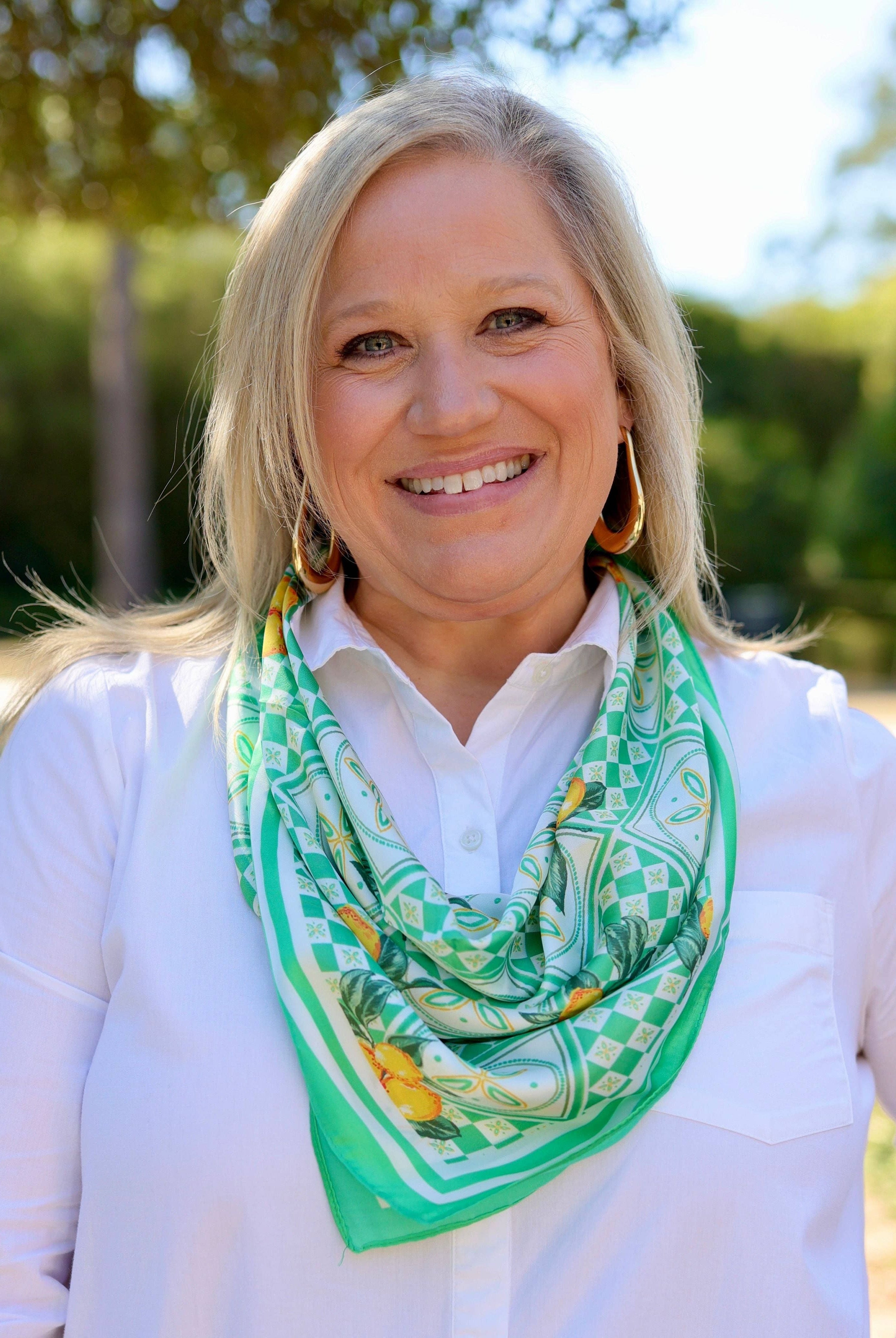 Green Naples Citrus Print Scarf by Caroline Hill, showcasing a vibrant citrus pattern on lightweight fabric.