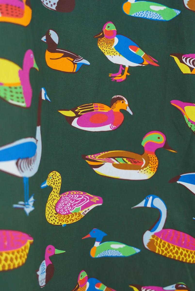 Caryn Lawn Sutton Skirt olive duck print close-up, multicolor illustrated ducks on olive green cotton poplin