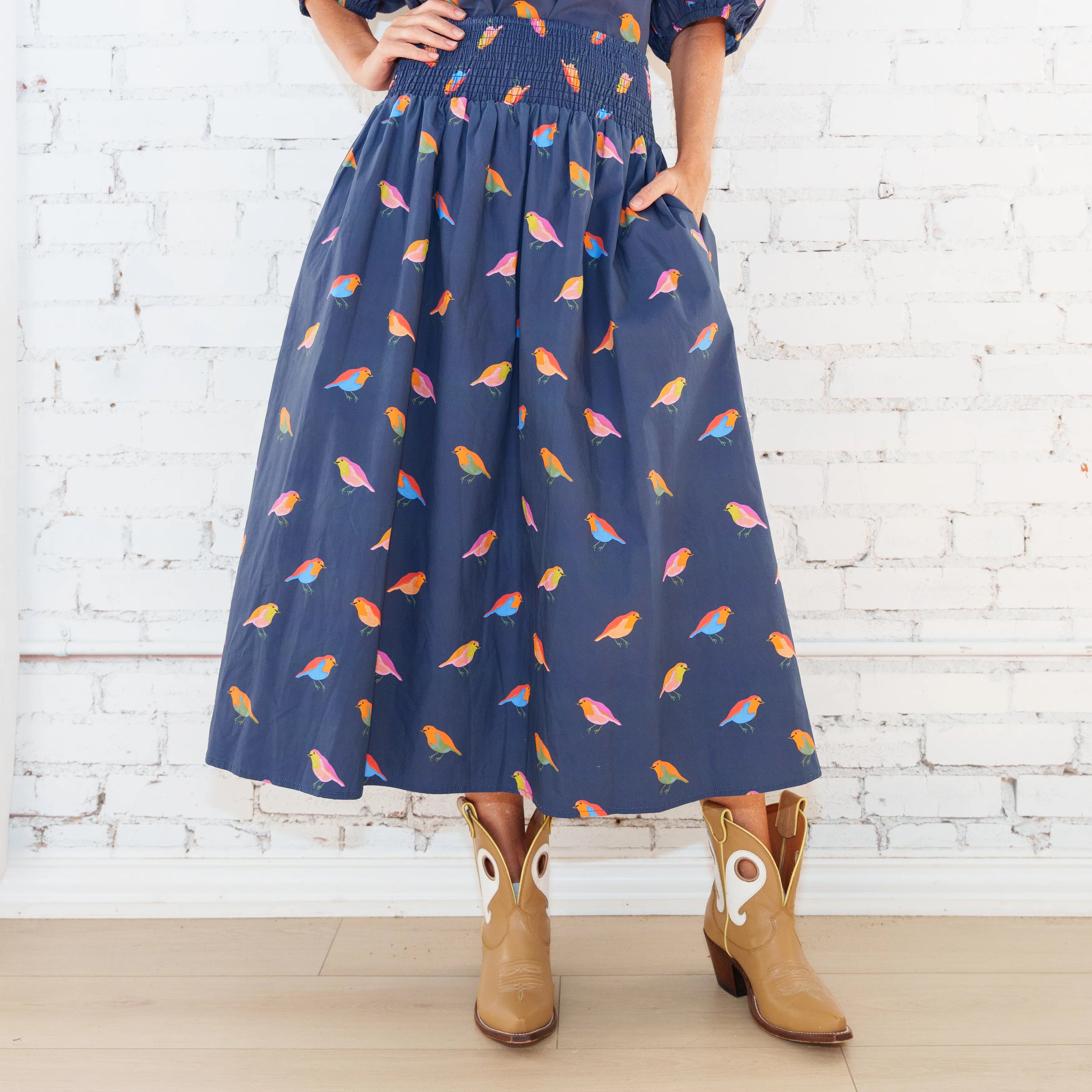 Caryn Lawn Sutton Skirt in navy bird print, gathered midi skirt with side pocket, front close-up view