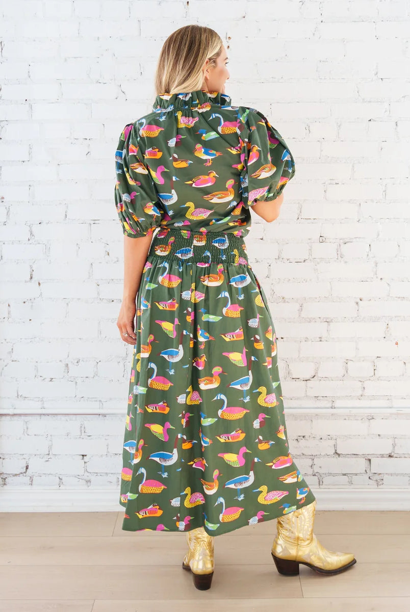 Caryn Lawn Sutton Skirt in olive duck print, gathered midi skirt, smocked waistband, back view with matching to