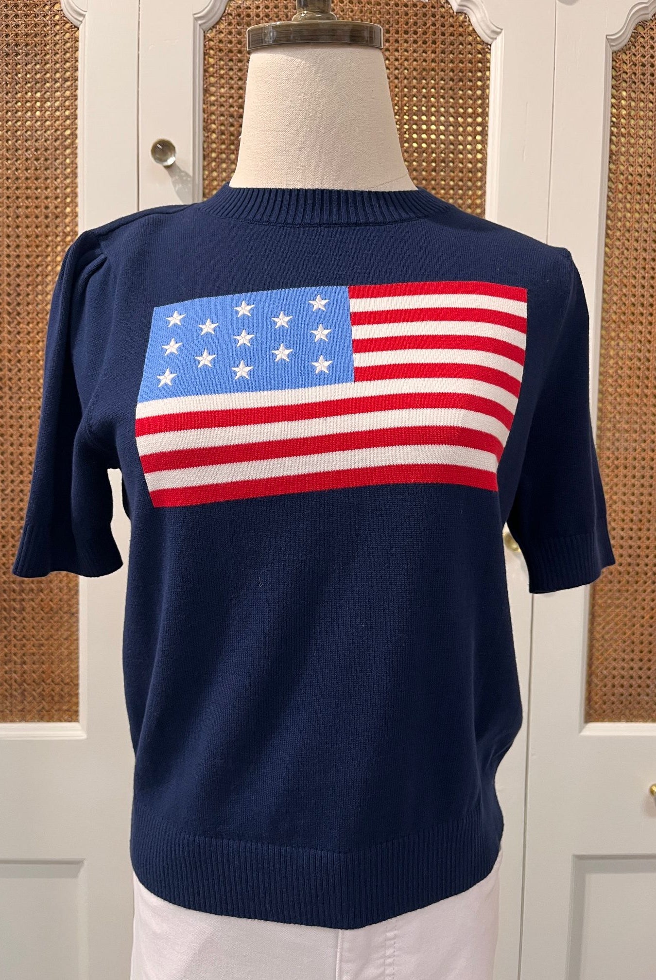 Navy puff sleeve flag sweater by Duffield Lane, stylish top with bold flag pattern and textured knit design.