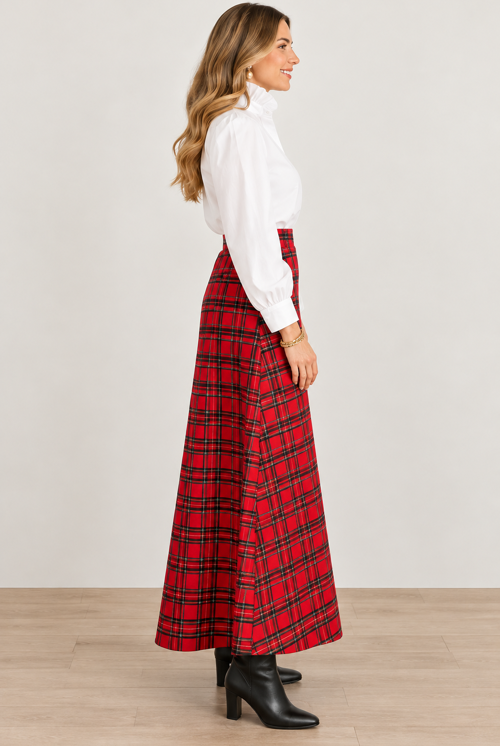 Holly Skirt by Sail to Sable in red and green plaid with an ankle-length flared hem, side view