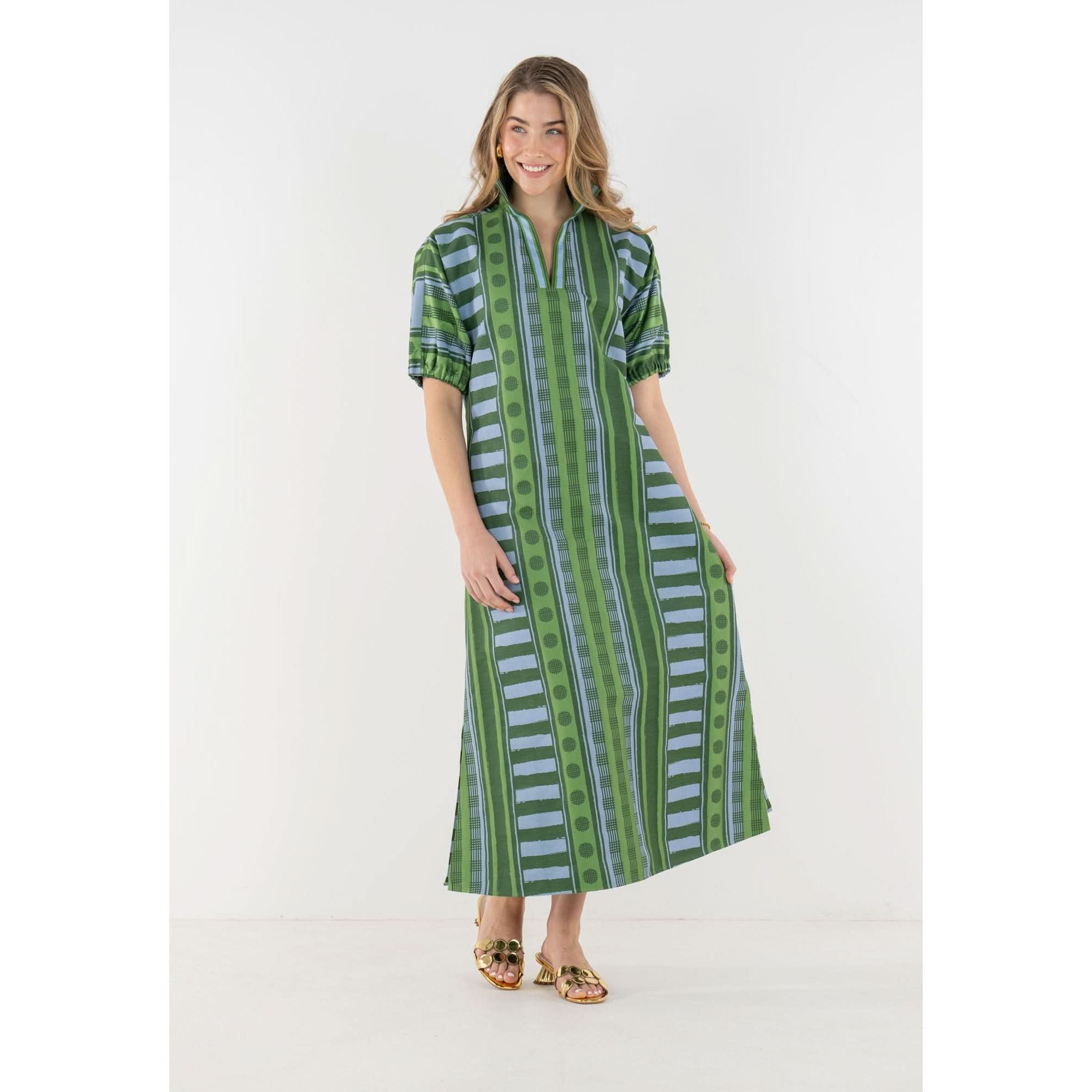 Emily McCarthy Poppy Maxi dress in Forest Jubilee floral print, featuring a flowing silhouette and vibrant colors.