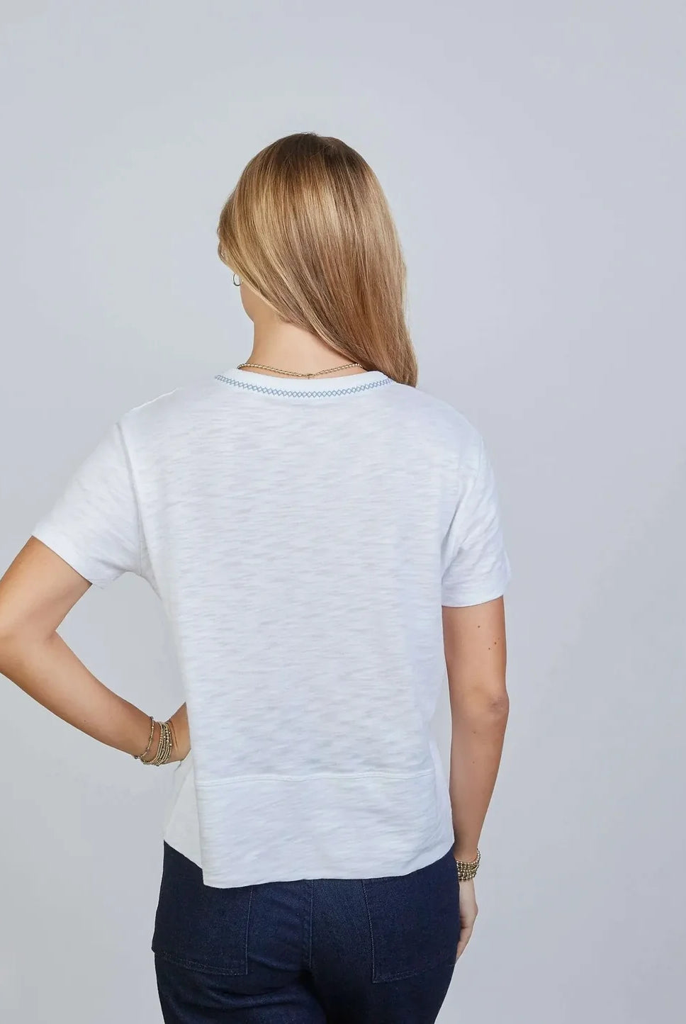 White Charli Tee by Erin Gray featuring blue stitching, casual top with short sleeves and a relaxed fit.