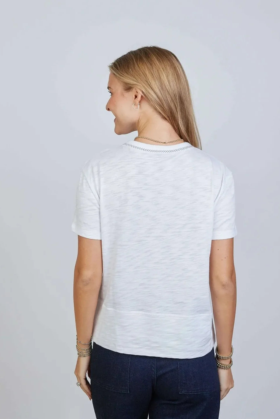White Charli Tee by Erin Gray featuring gray stitching, shown from the back with a relaxed fit and casual style.