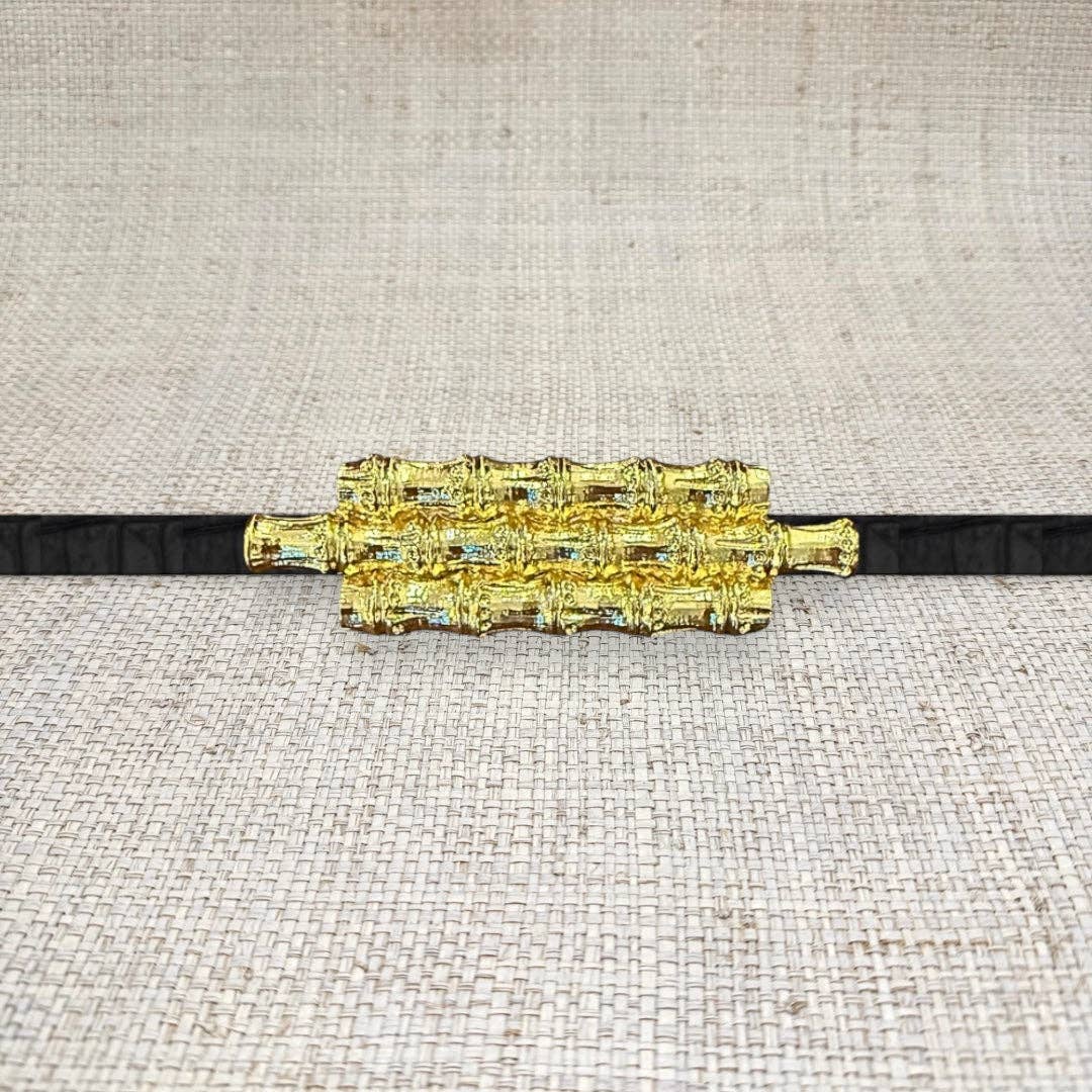 Triple bamboo belt buckle by Garland, featuring natural bamboo design and sturdy metal clasp on a neutral background.