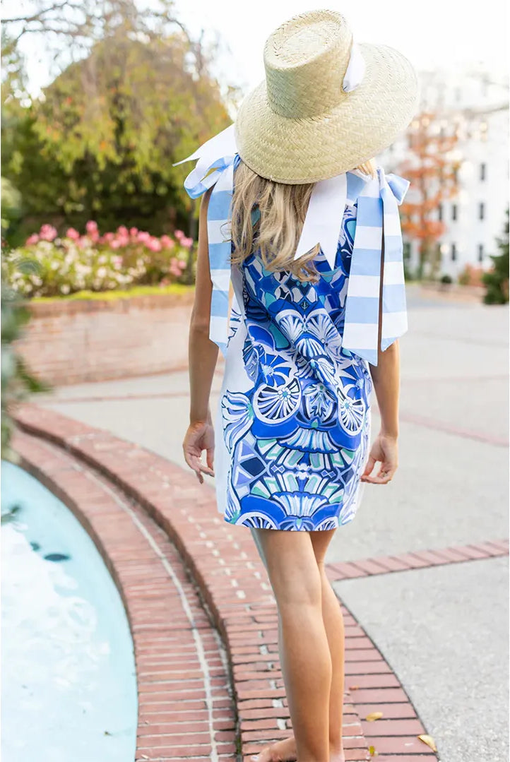 Beaufort A-Line Mini Dress in Blue Lapis by House of MBR — back view, cobalt blue medallion print, oversized gingham bow straps