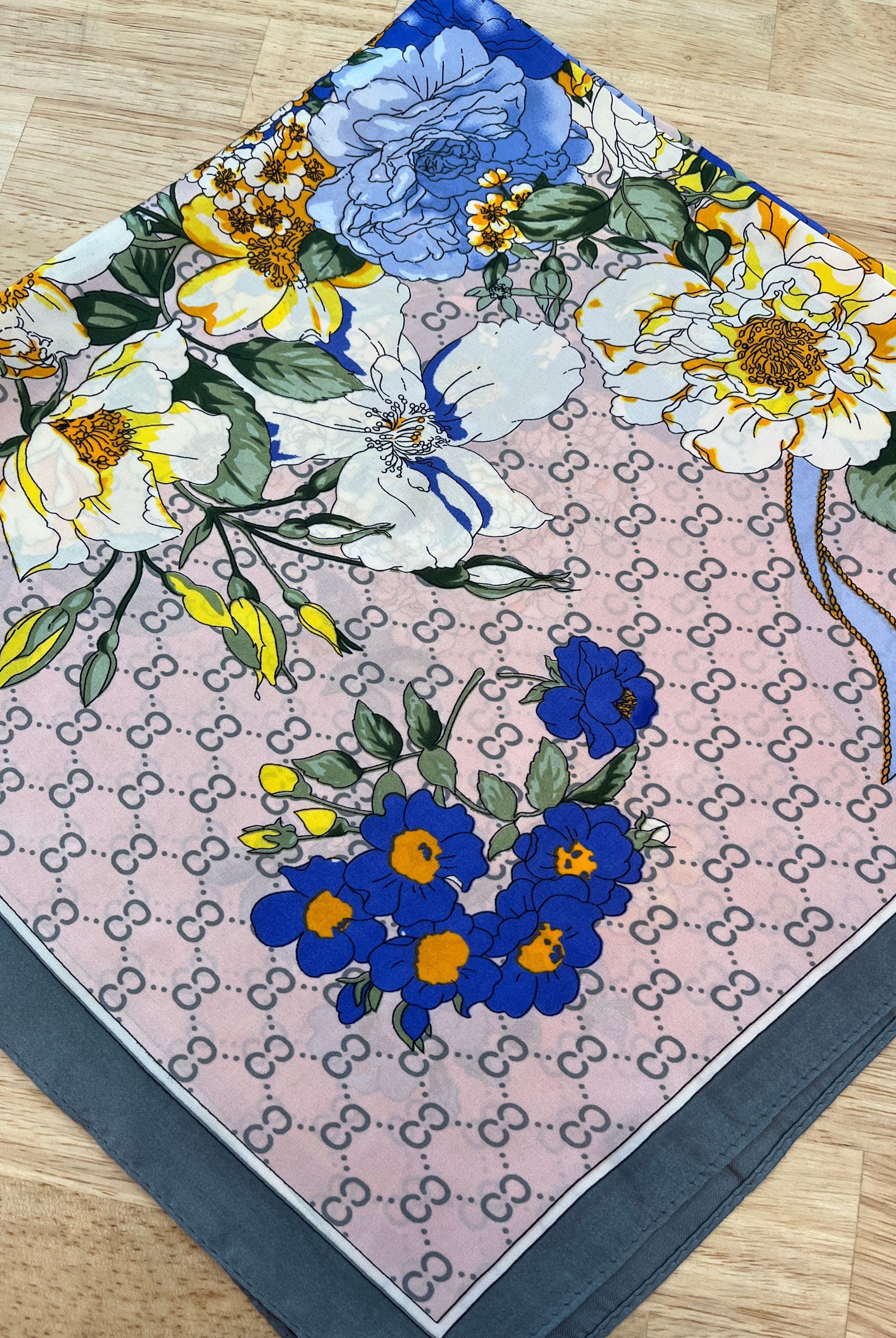 Fornash floral scarf accessory featuring a colorful, patterned fabric with vibrant floral designs.