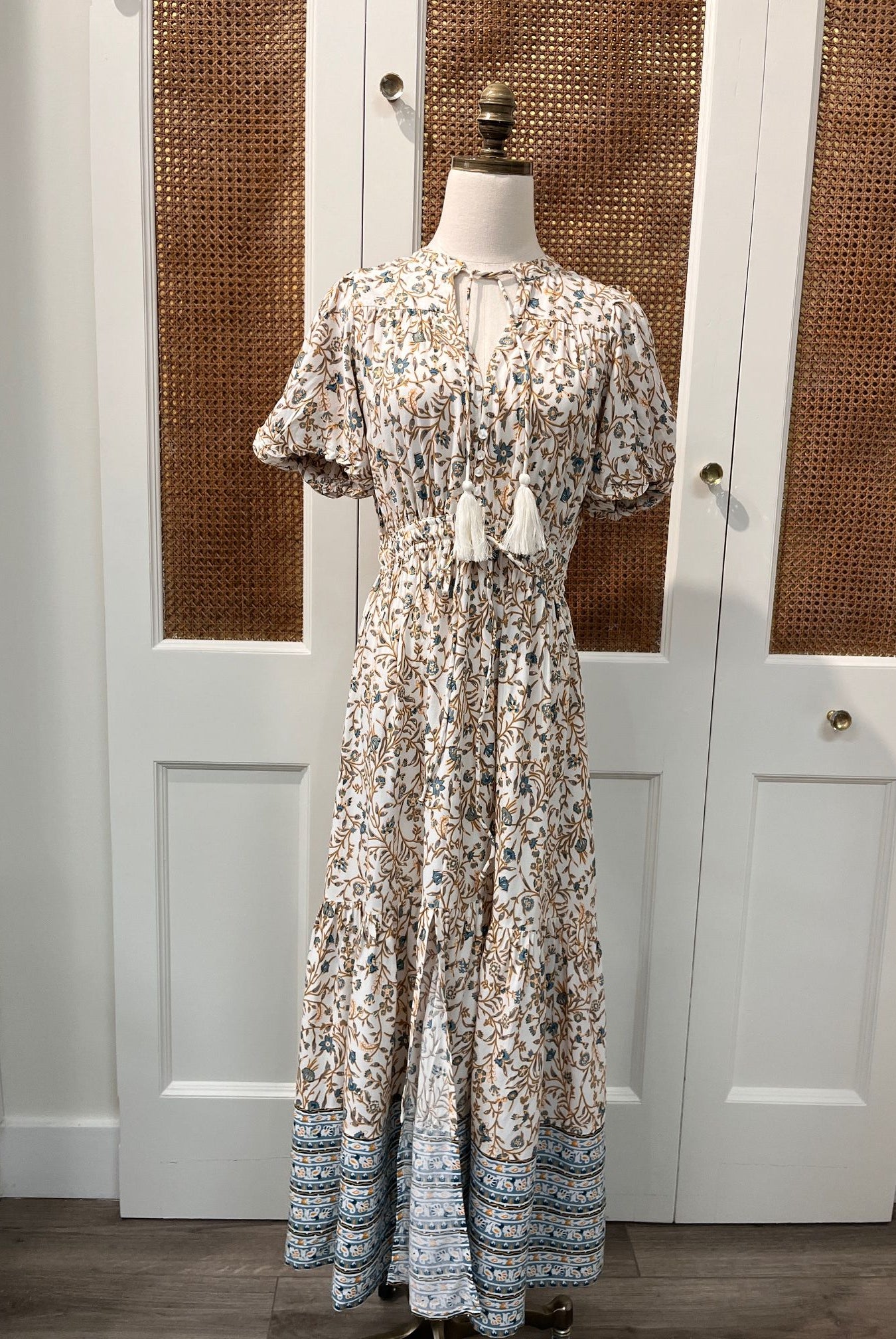 Elan Carina Dress displayed on a hanger, featuring a stylish, flowing design in a soft, elegant fabric suitable for casual or formal wear.
