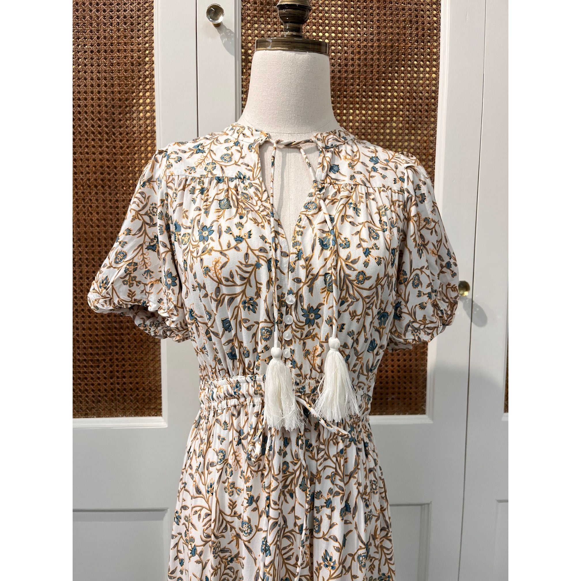 Elan Carina Dress shown in a stylish design, featuring flowing fabric and elegant details, perfect for casual or semi-formal wear.