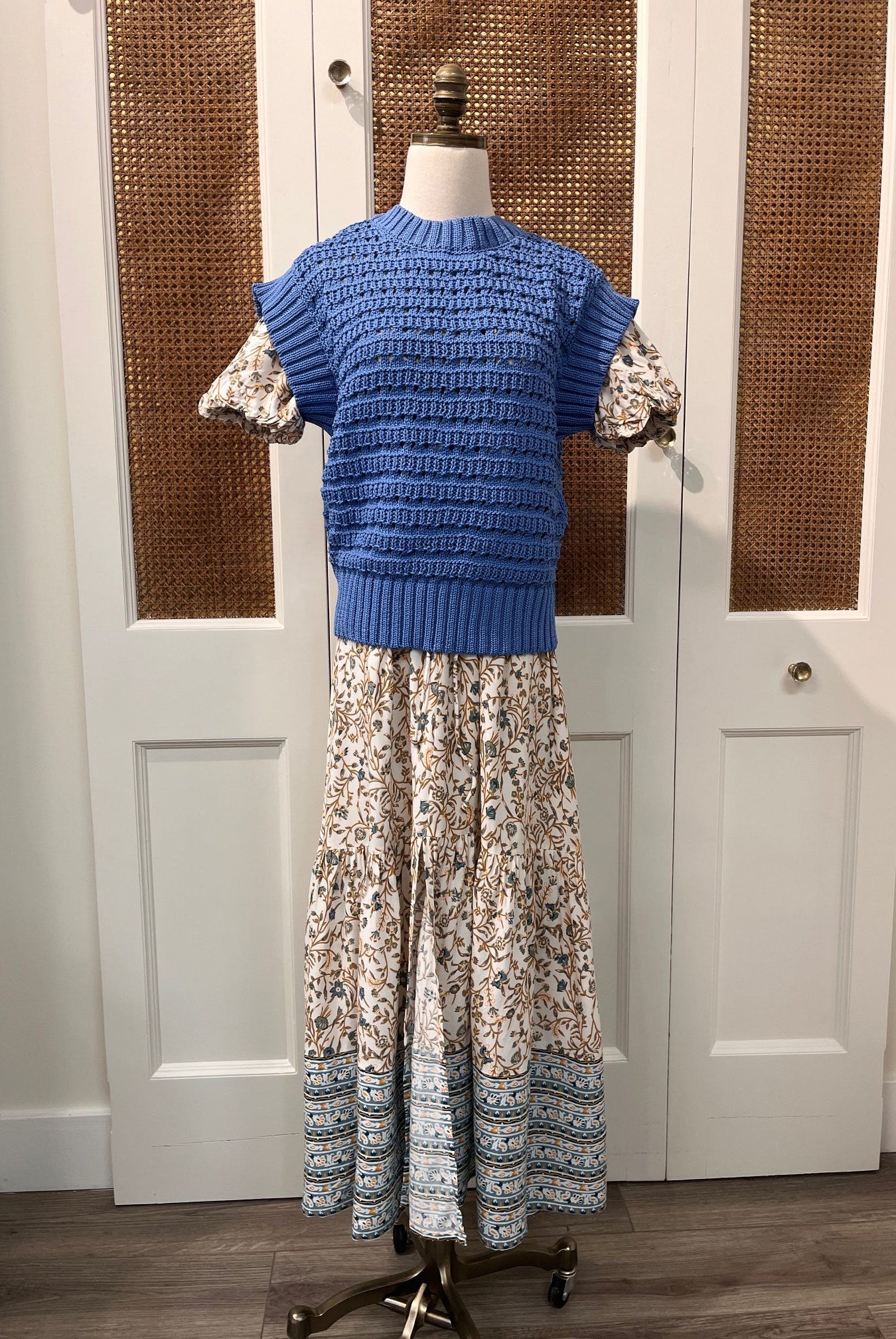 Elan Carina Dress hanging on a hanger, featuring a flowy fabric and elegant design, perfect for casual or semi-formal occasions.