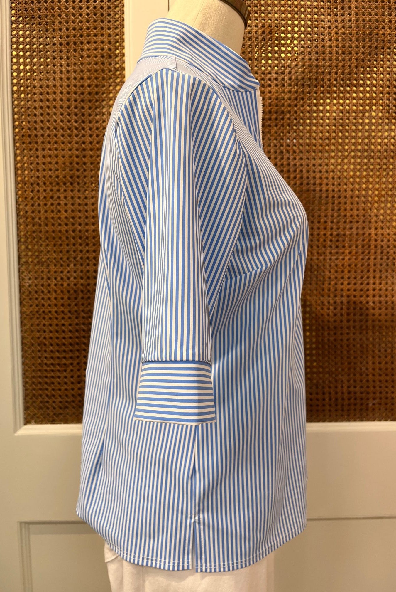 Jude Connally Juliet Top in pinstripe periwinkle with long sleeves and a relaxed fit, displayed on a hanger.