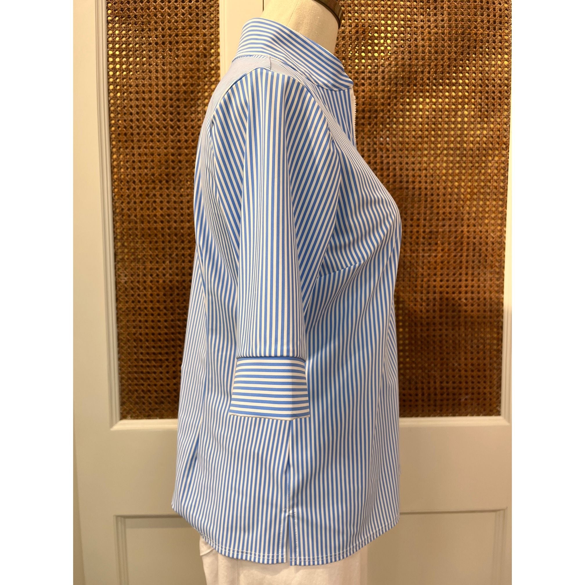 Jude Connally Juliet Top in pinstripe periwinkle with long sleeves and a relaxed fit, displayed on a hanger.