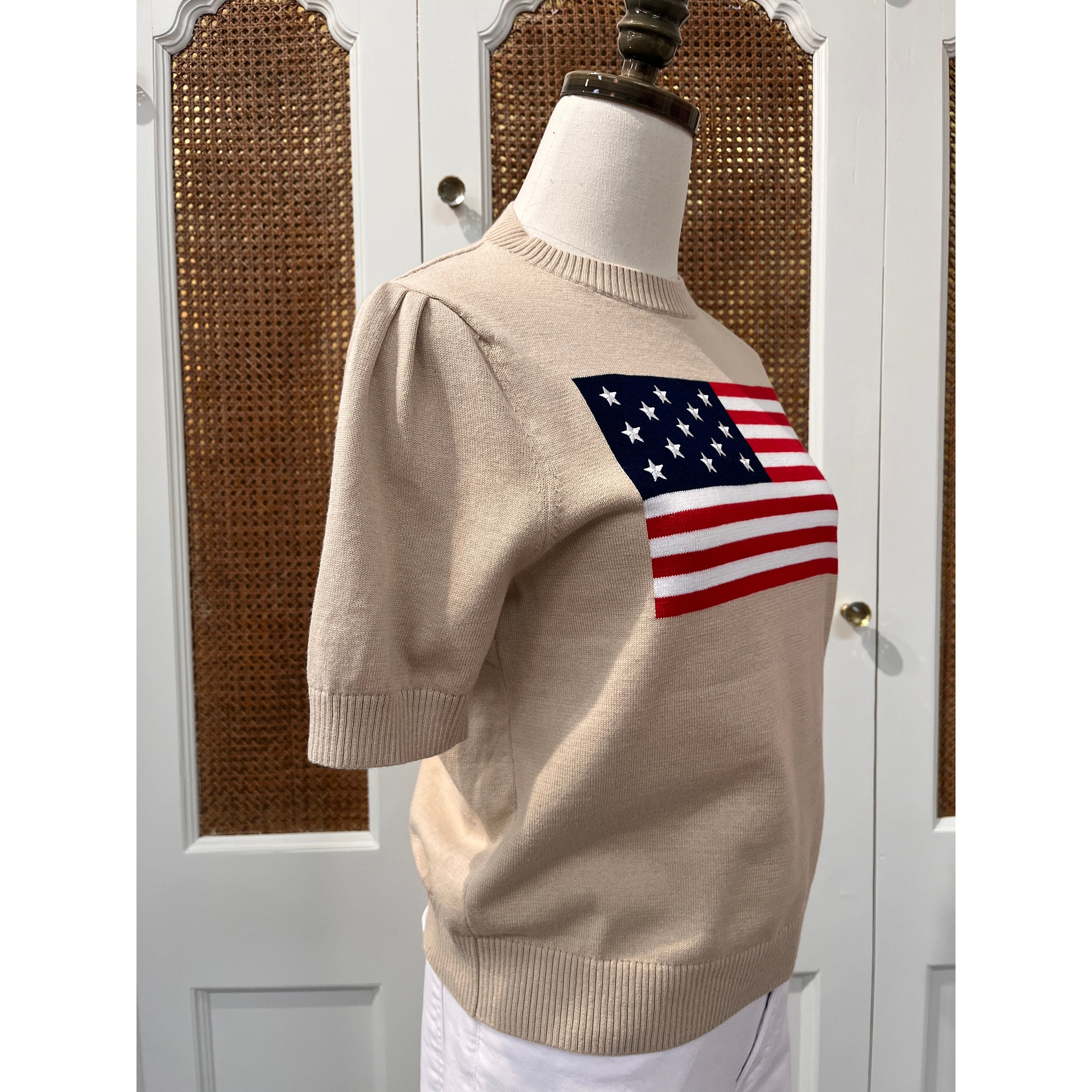 Tan puff sleeve flag sweater top by Duffield Lane, featuring a stylish flag pattern and cozy knit fabric.