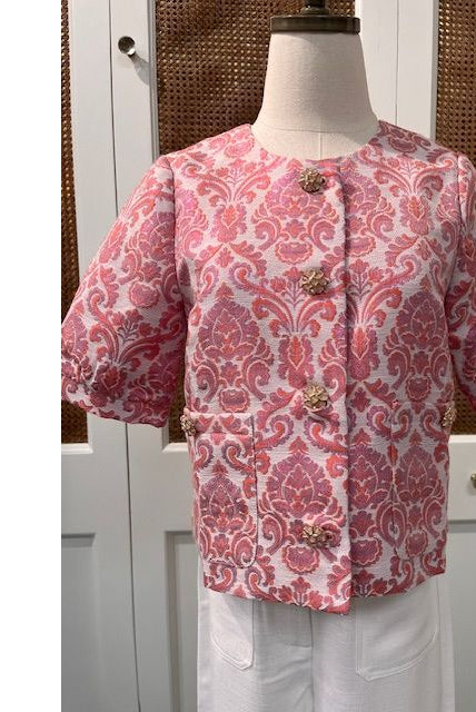 JADE Taylor jacket top displayed on a hanger, showcasing its stylish design and fabric texture.