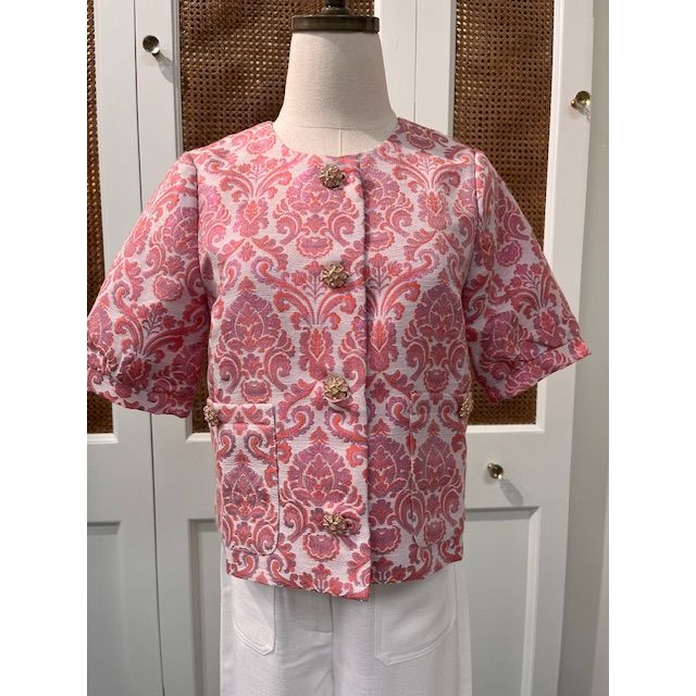 JADE Taylor jacket top displayed on a hanger, showcasing its stylish design and fabric texture.