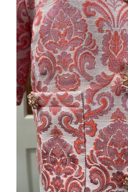 JADE Taylor jacket top in black, featuring a stylish collar and button details, displayed on a hanger against a white background.