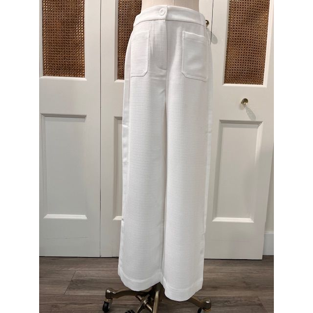 JADE Agnes Pants, stylish women's bottoms with a relaxed fit and neutral color, shown on a model in a casual setting.