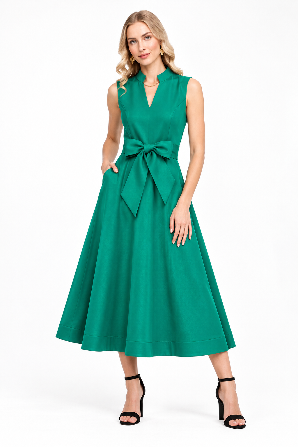 Rosemary Dress by Jade in emerald green, front view with stand collar, bow-tie waist, pockets, and flared midi skirt