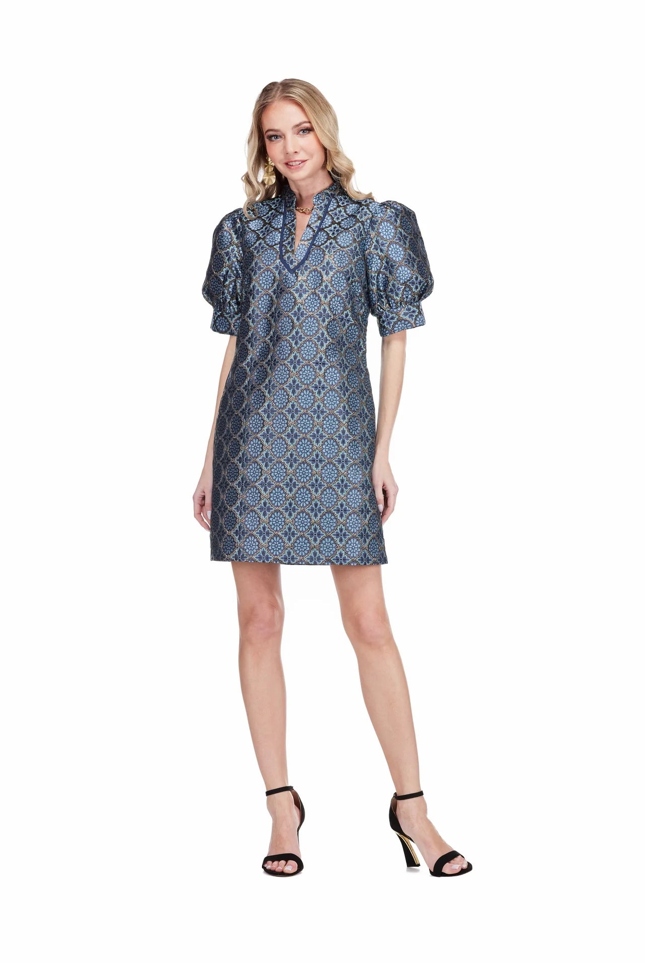 Georgia Dress by Jade in Gilded Trellis, front view, blue and gold metallic trellis jacquard, stand collar V-notch neckline trimmed in navy, puff sleeves, A-line shift silhouette