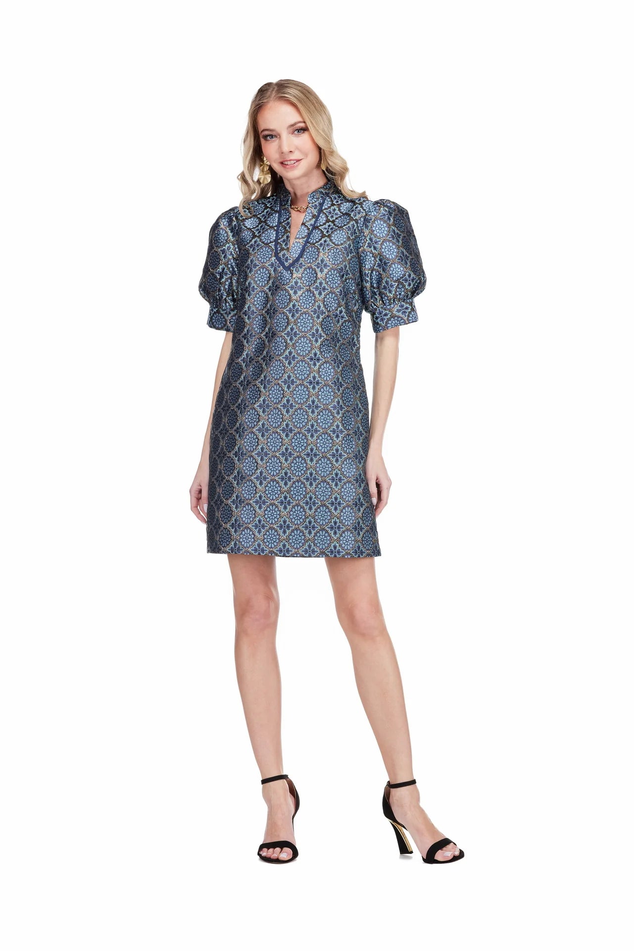 Georgia Dress by Jade in Gilded Trellis, front view, blue and gold metallic trellis jacquard, stand collar V-notch neckline trimmed in navy, puff sleeves, A-line shift silhouette