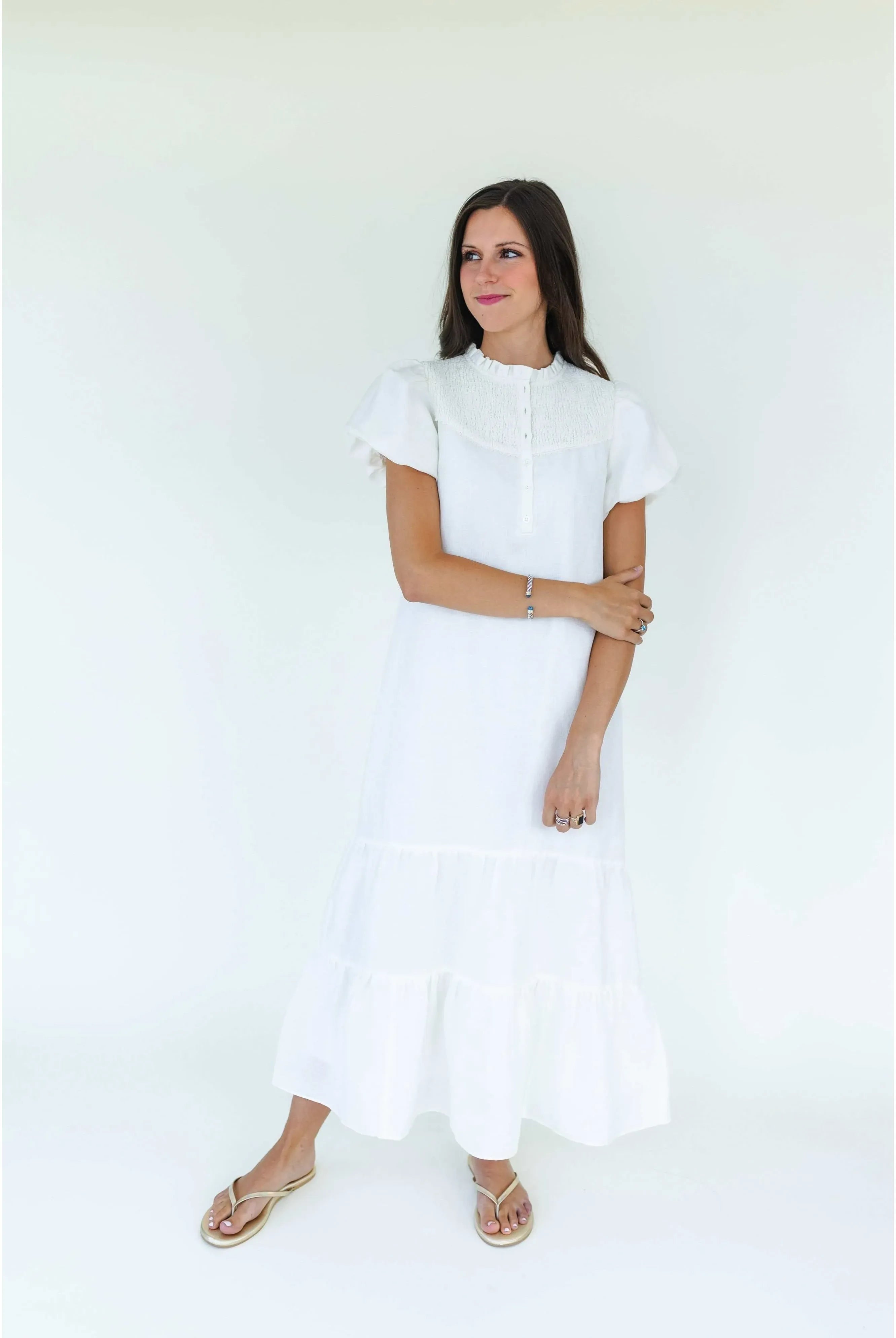 Mary George Gracie Dress, elegant women's dress with floral pattern and sleeveless design, shown on a hanger.