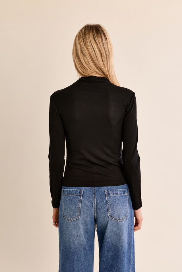Nancy Top by Molly Bracken in Black, back view, fitted mock turtleneck, long sleeves with subtle shoulder ruching, slim silhouette, fine ribbed texture style # EF1662EN