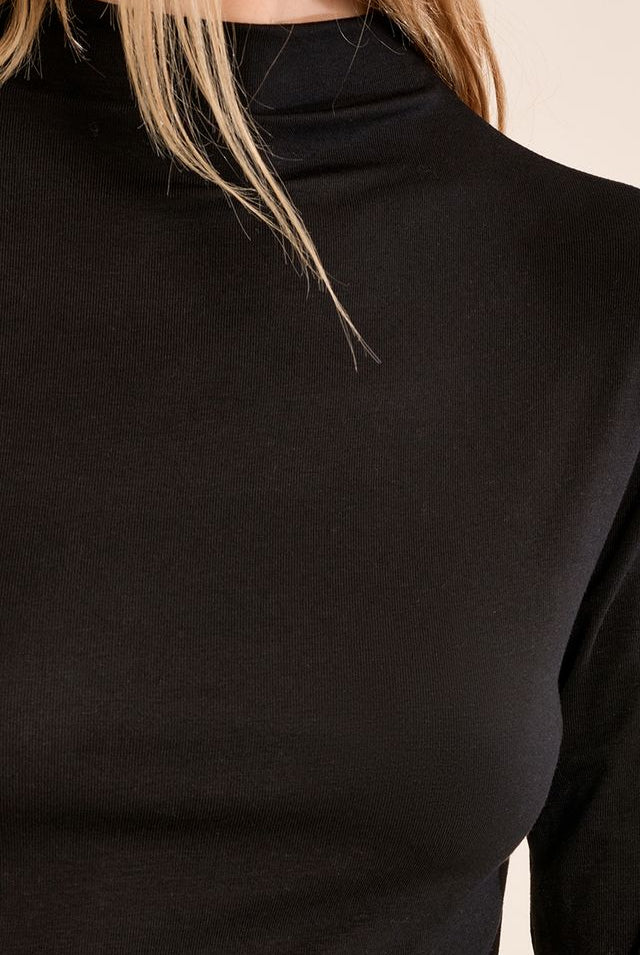 Nancy Top by Molly Bracken in Black, zoom view, fitted mock turtleneck, long sleeves with subtle shoulder ruching, slim silhouette, fine ribbed texture style # EF1662EN