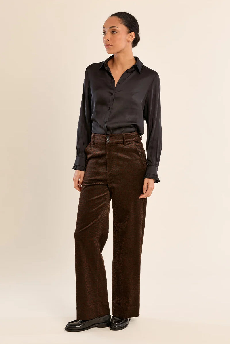 Finley Trousers by Molly Bracken in brown satin animal print, straight leg and high waist, angled side view