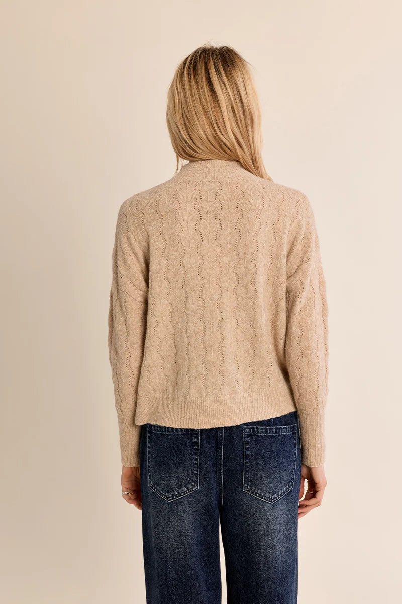 Avery Sweater by Molly Bracken in golden beige wavy openwork knit with high collar and ribbed hem, back view