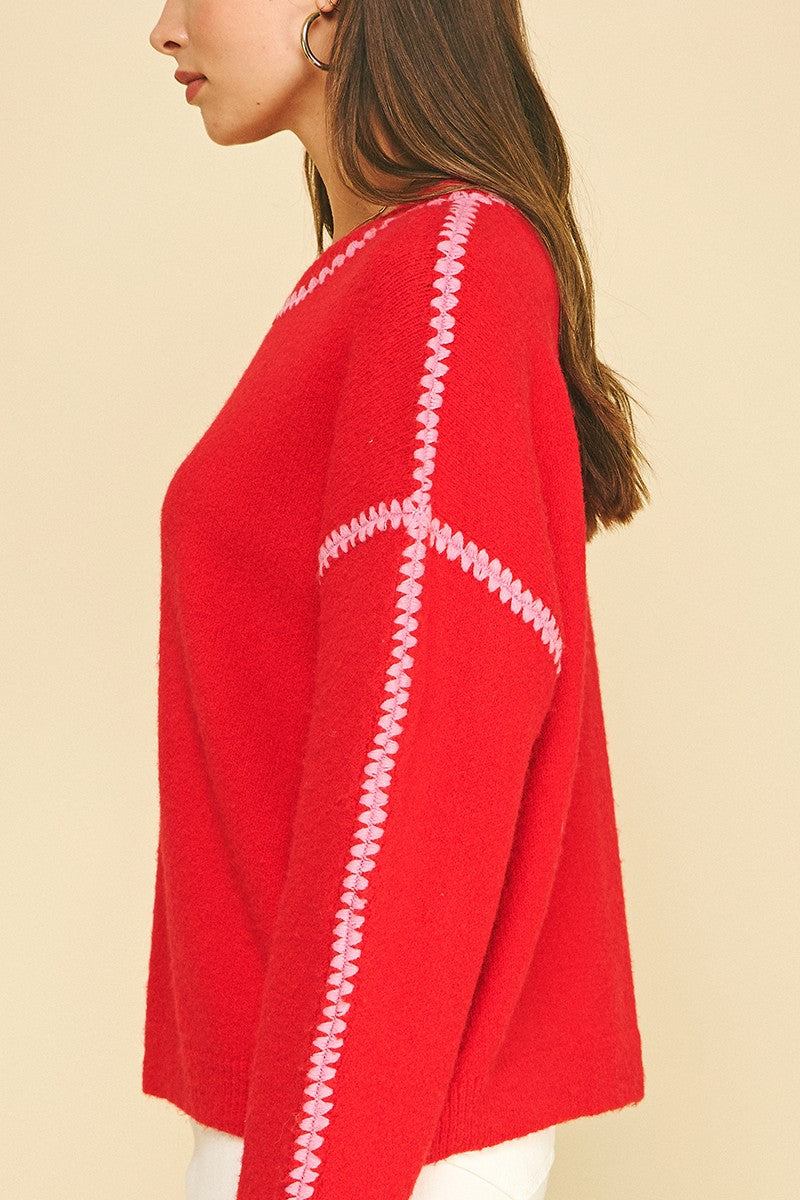 Blaire Sweater 7520W by Pinch red knit close-up showing pink stitch embroidery detail at seams, side profile