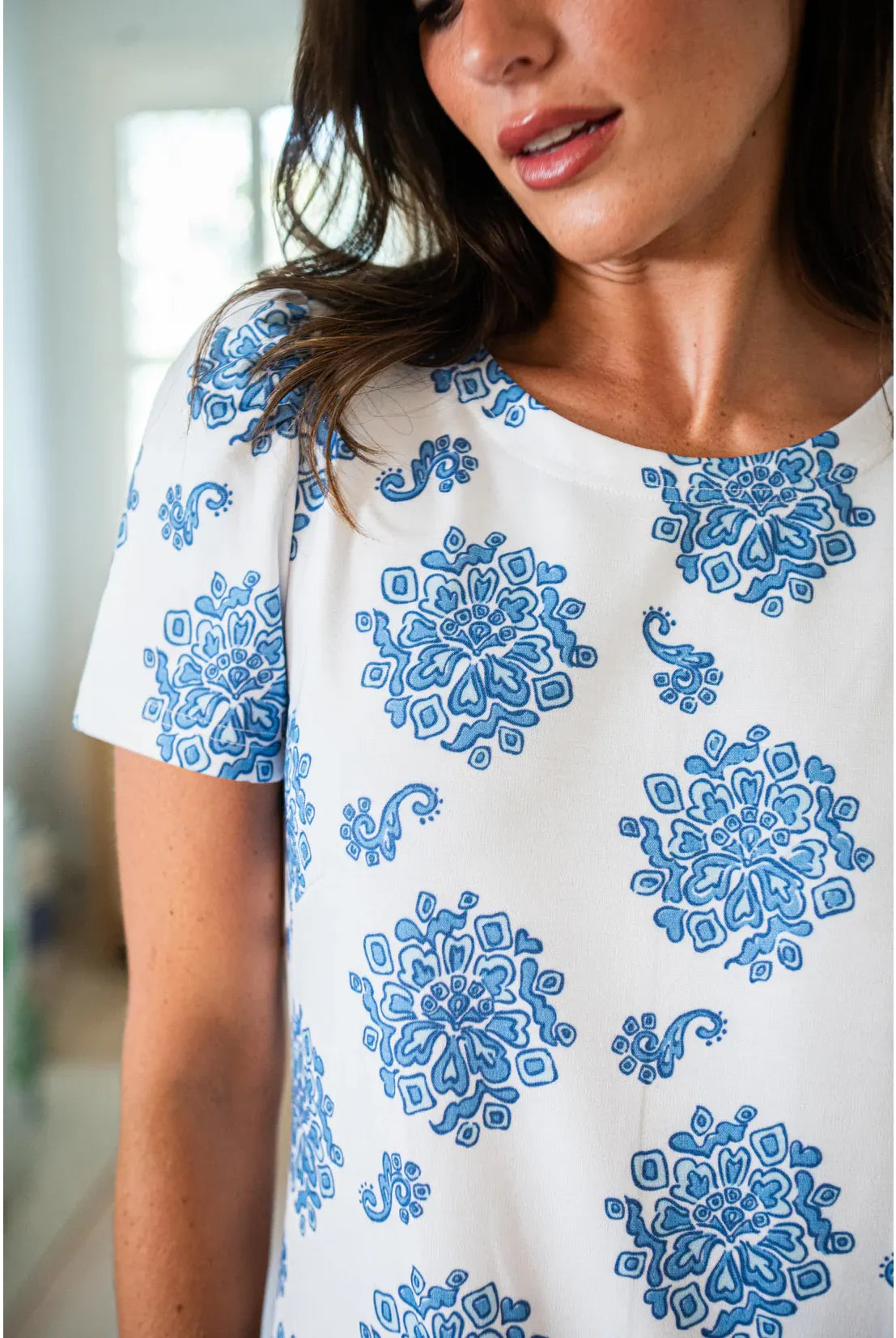 Love Bouquet Sail to Sable dress featuring a floral print, sleeveless design, and a fitted waist on a model.