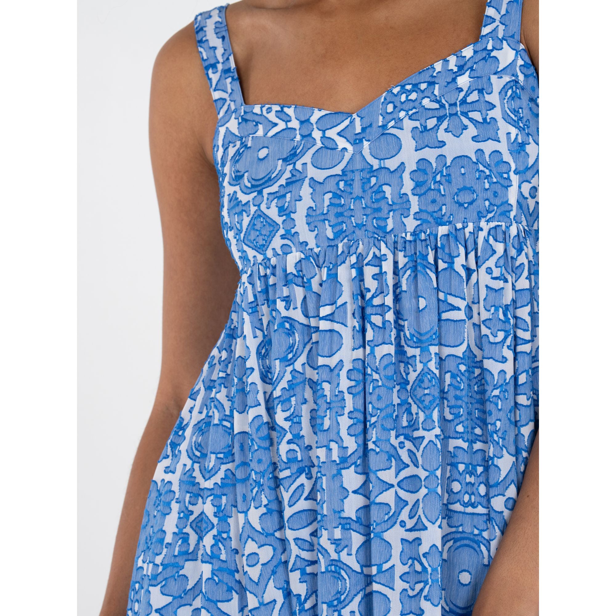 Emily McCarthy Capri dress featuring a stylish design with detailed fabric and elegant fit, perfect for warm weather.