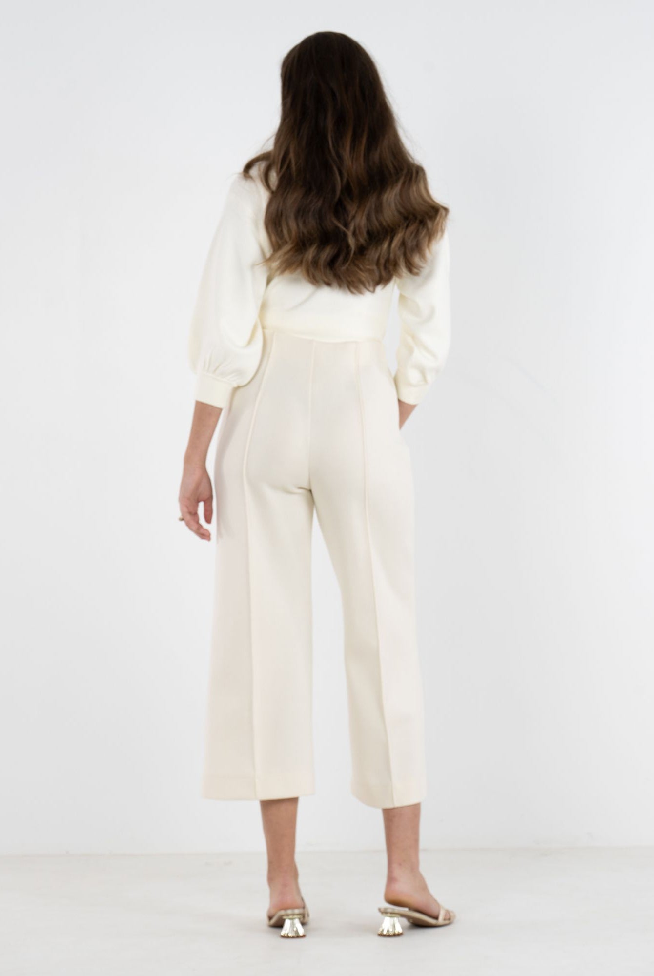 Back view of Emily McCarthy Luna Pants, stylish cropped bottoms with a tailored fit and subtle design details.