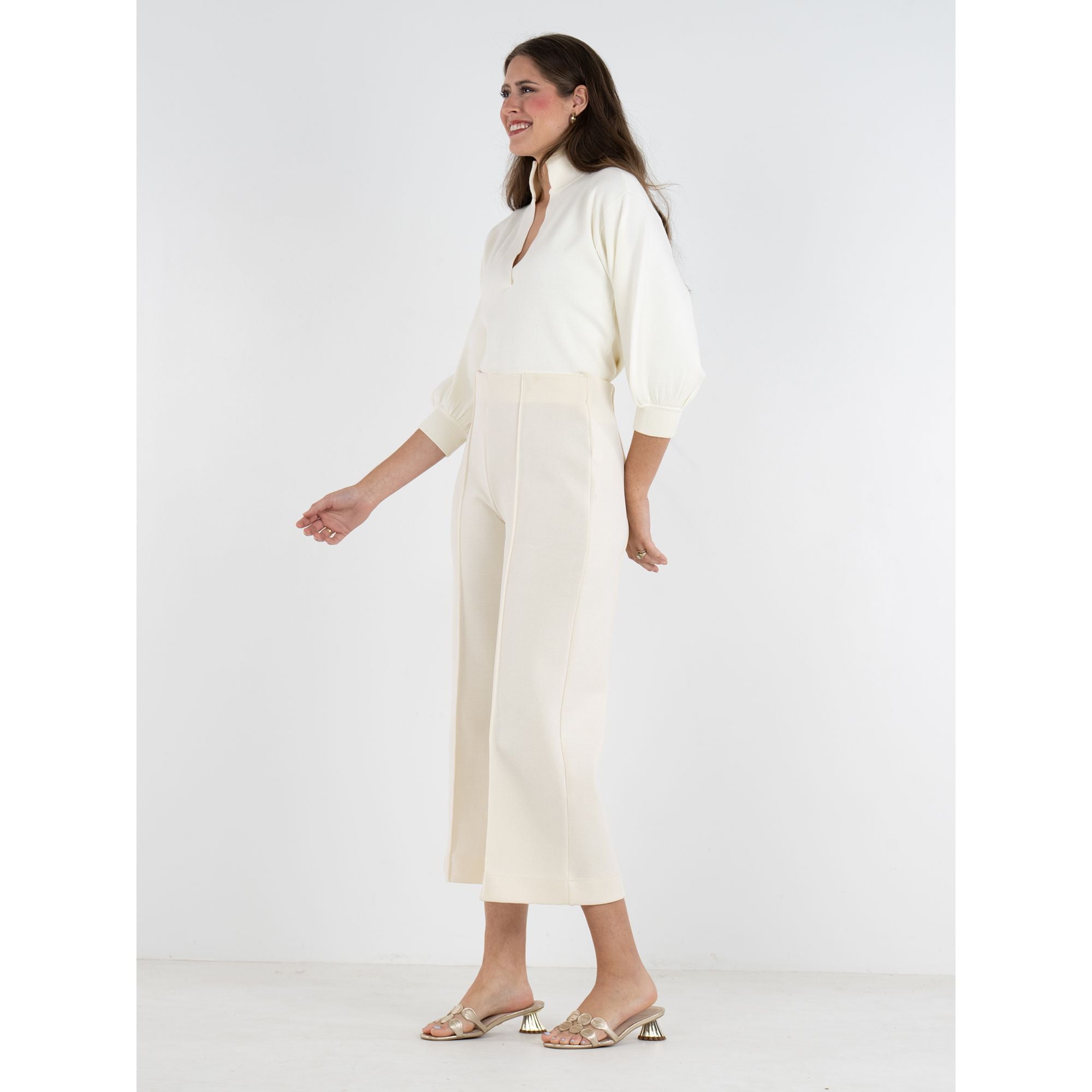 Emily McCarthy Luna Pants, cropped bottoms with side details, styled in a relaxed fit and neutral fabric for casual wear.