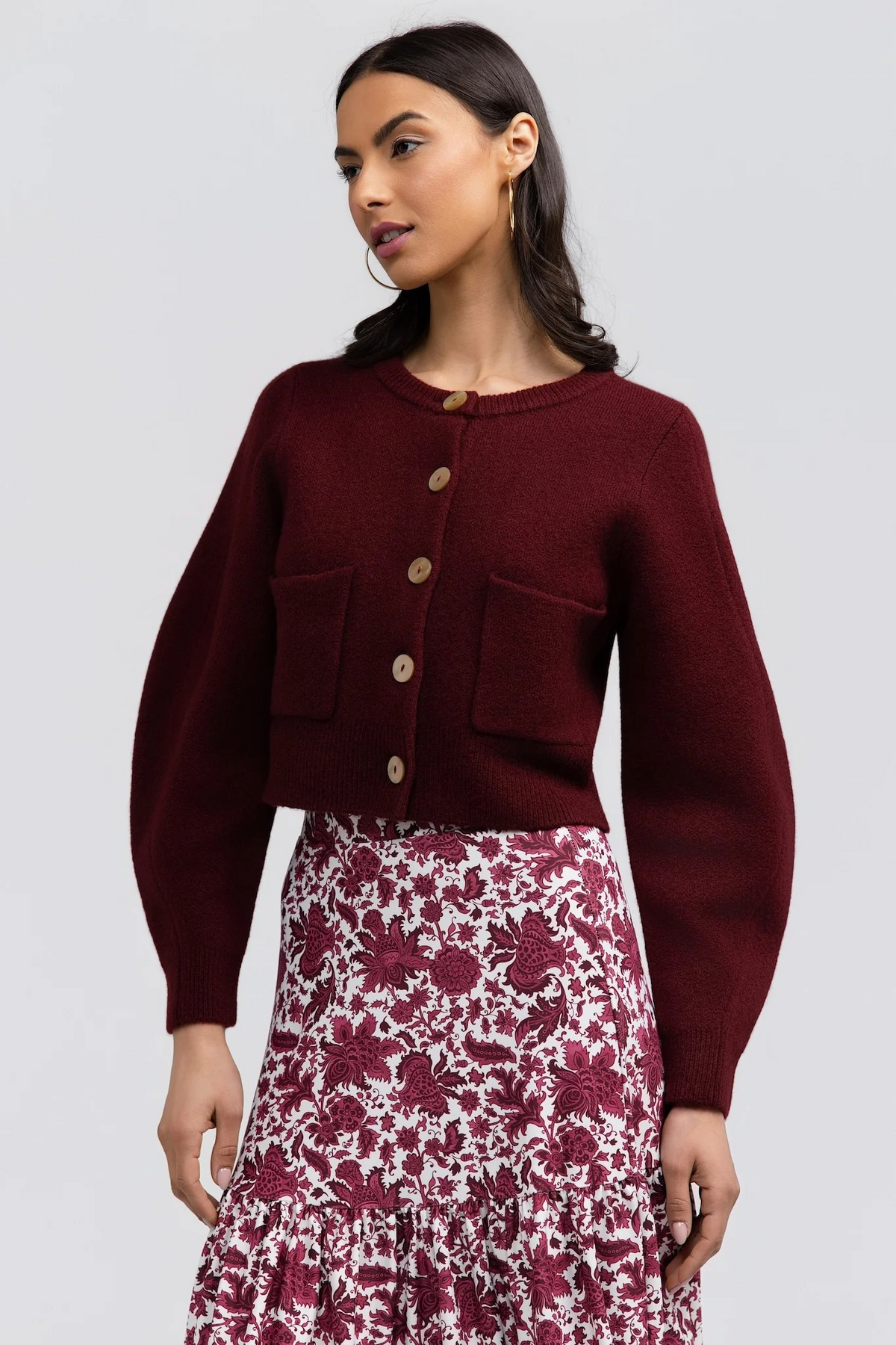 Hildy Sweater by Smith & Quinn in burgundy with contrasting buttons, front patch pockets, and balloon sleeves, front view