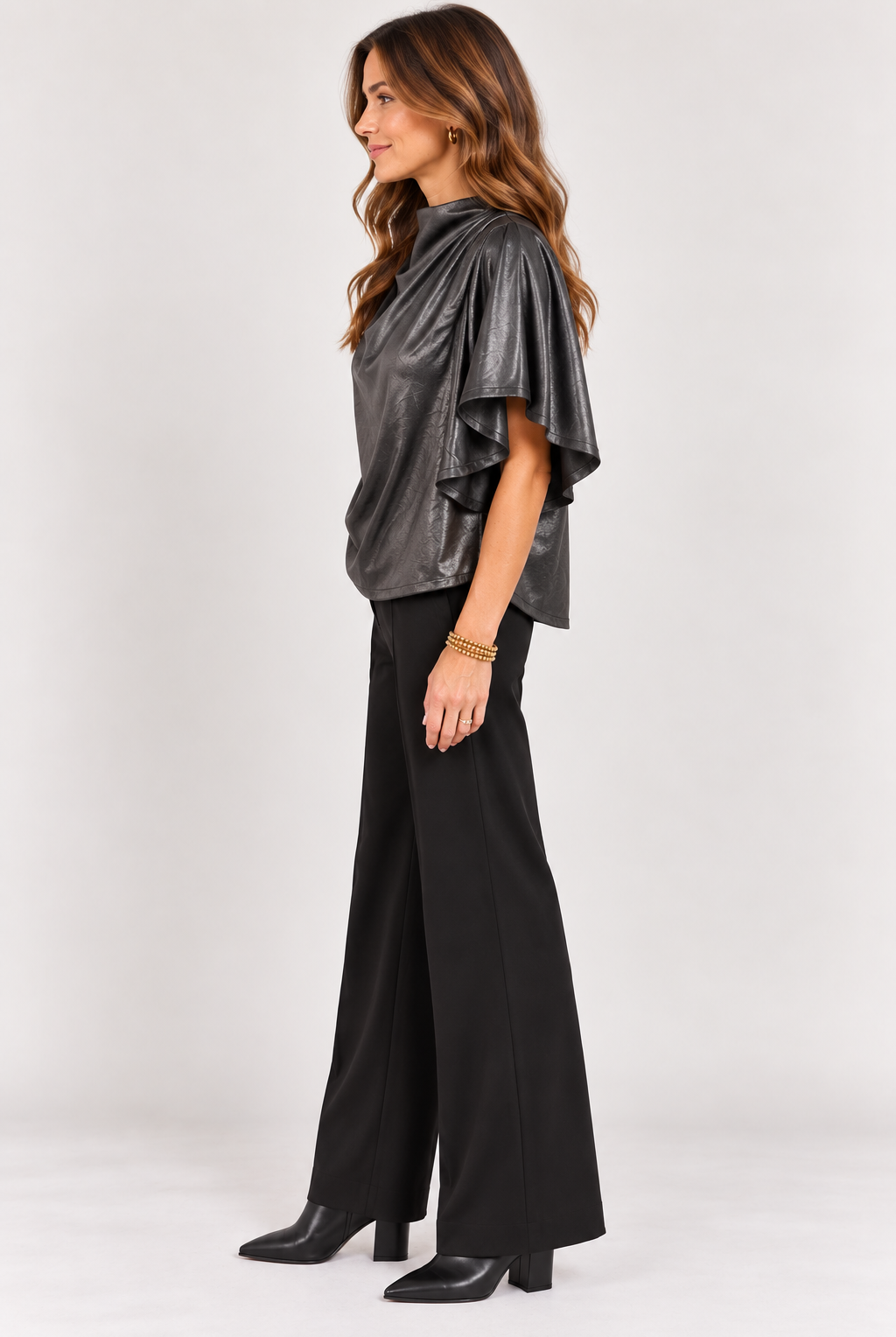 Side view of black Veronica Top showing the draped silhouette and flowy sleeves, Style #WCT4008-1