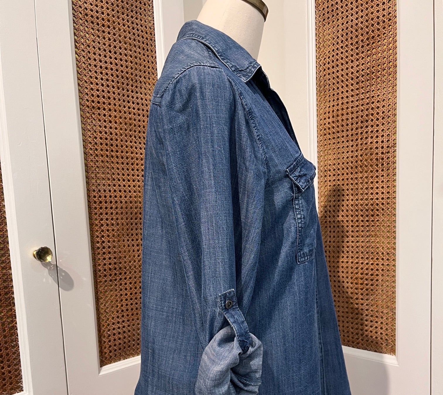 Talma Top by Velvet Heart — side view of medium wash denim button-front shirt with rolled tab sleeves and shirttail hem