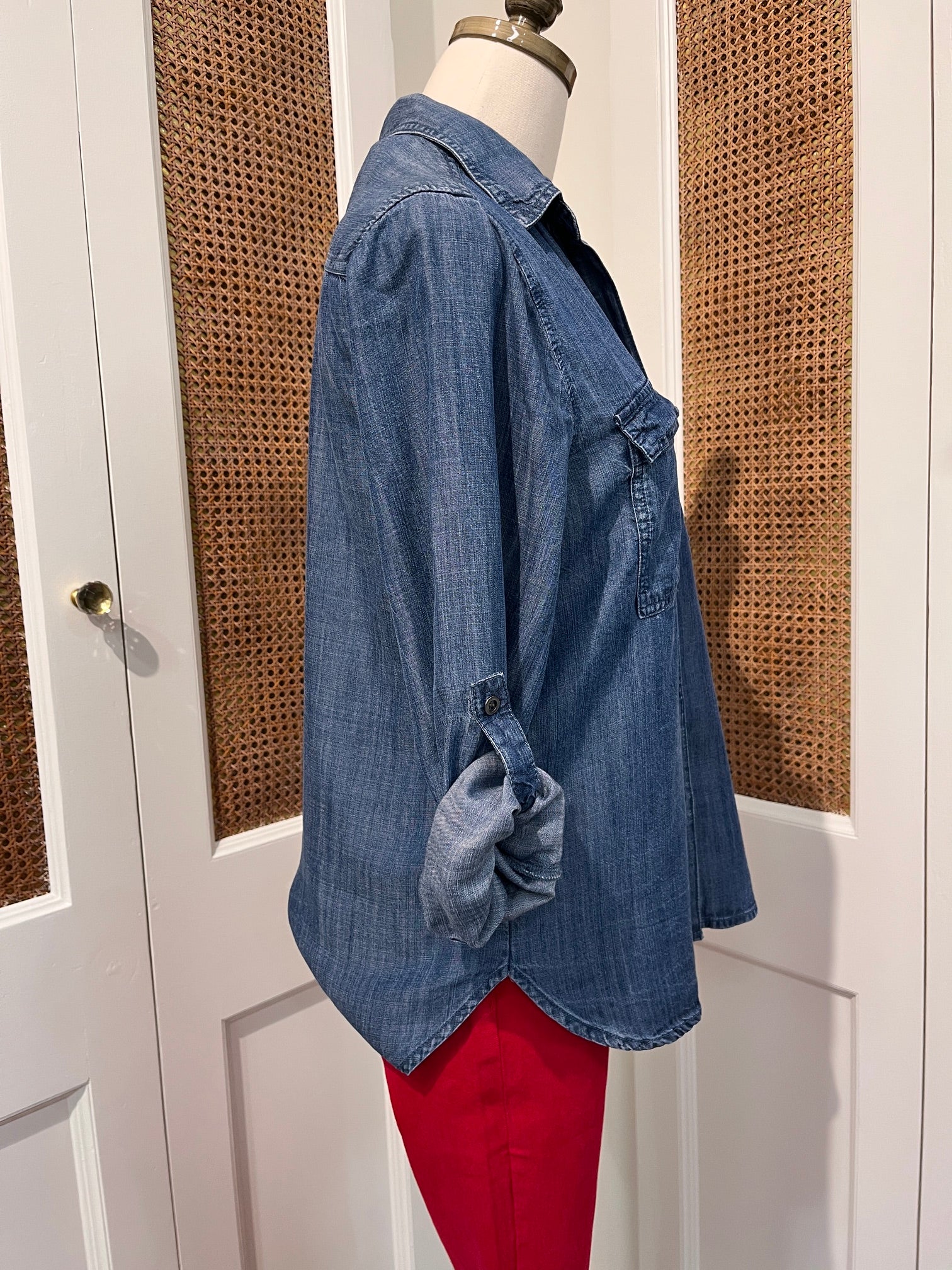 Talma Top by Velvet Heart — side view of medium wash denim button-front shirt with rolled tab sleeves and shirttail hem