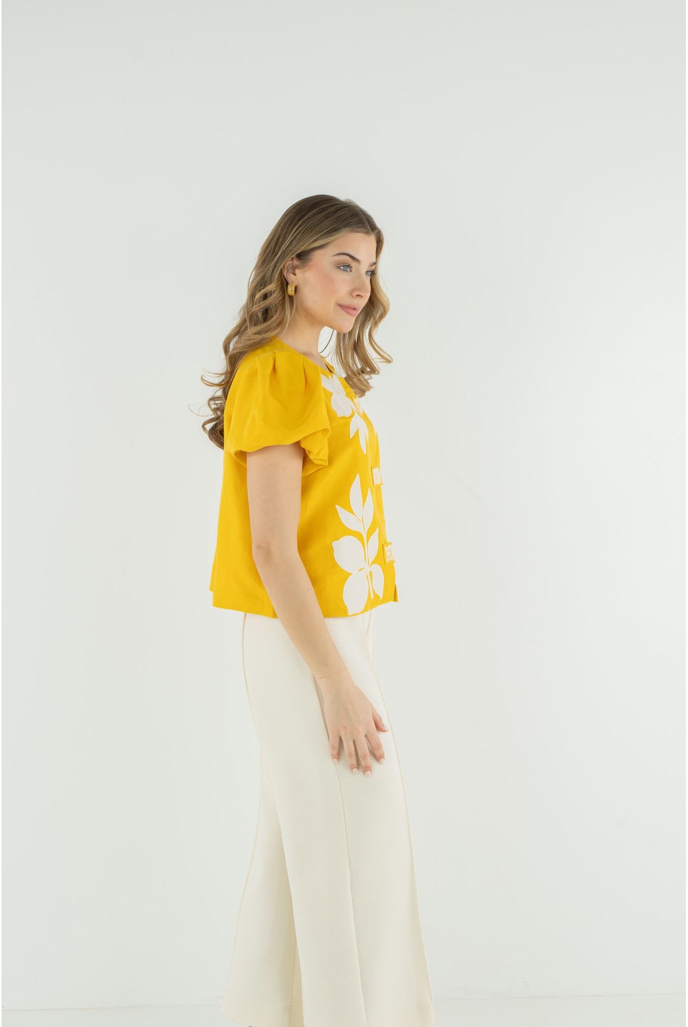 Emily McCarthy Isabella top, stylish women's sleeveless blouse in soft fabric with floral pattern and tailored fit.