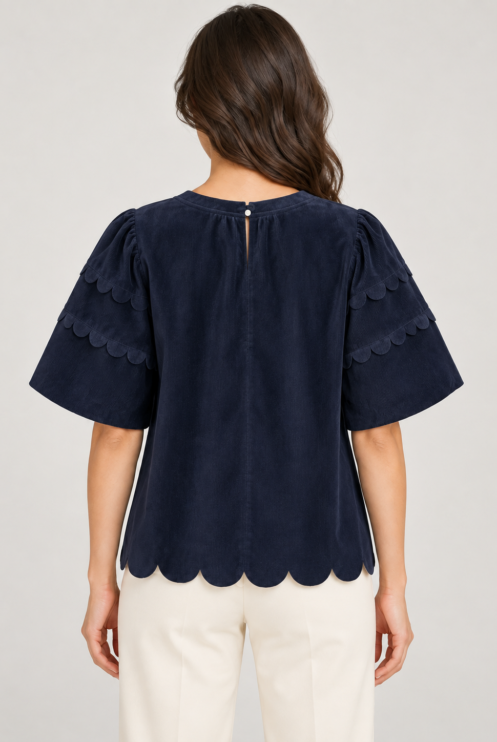 Greer Top by Voy in navy corduroy with bubble sleeves, scalloped trim and a scalloped hem